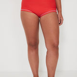 Person wearing red high-waisted original betty bottom shorts on a white background